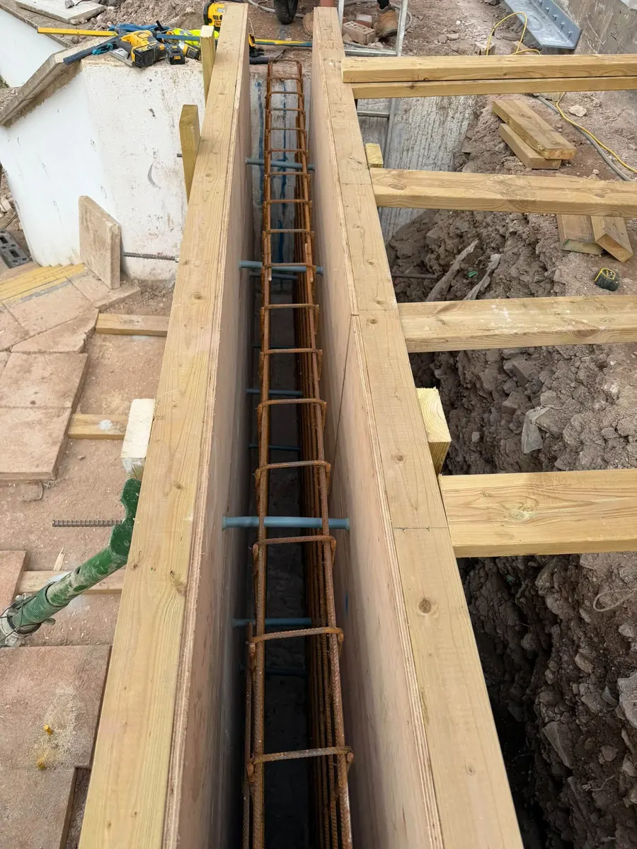 Timber formwork with a rebar cage ready for concrete, GRW Homes groundworks on a school project