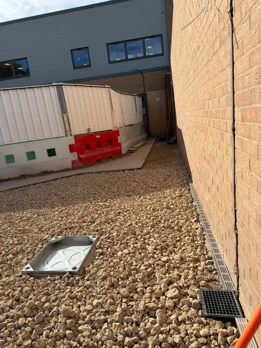 New gully and manhole cover set in sub-base, GRW Homes groundworks on a school project