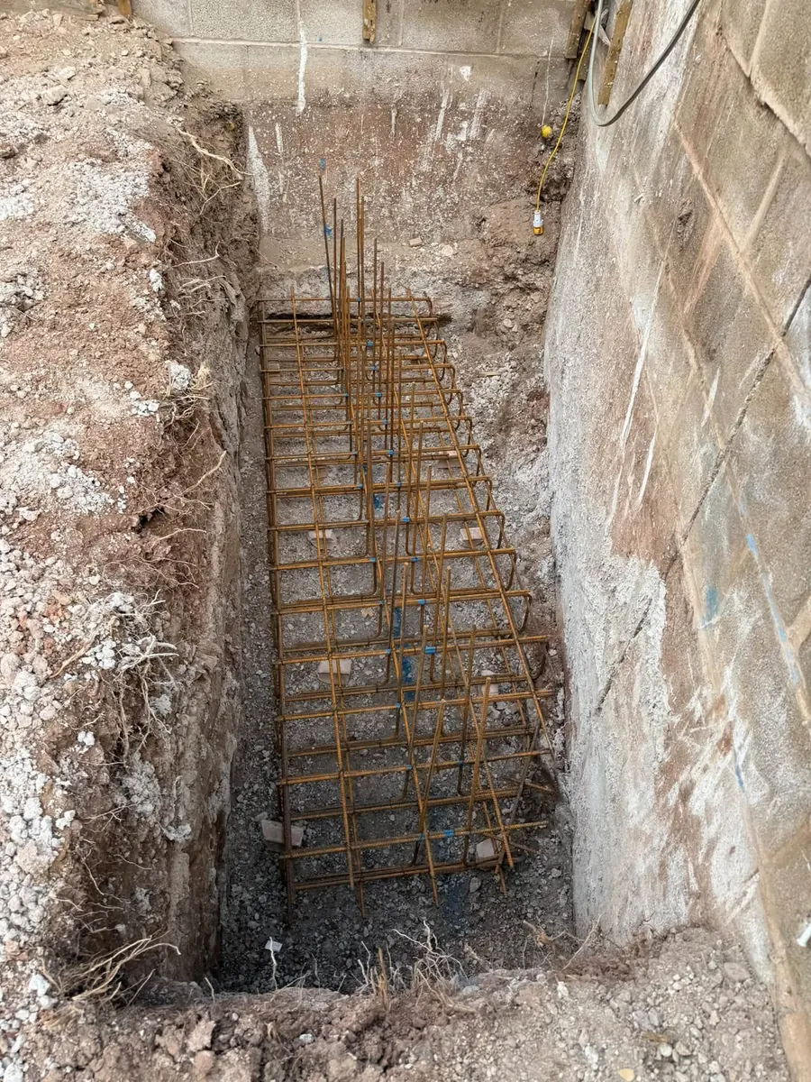 Steel rebar cage in a deep foundation pit, GRW Homes groundworks on a school project